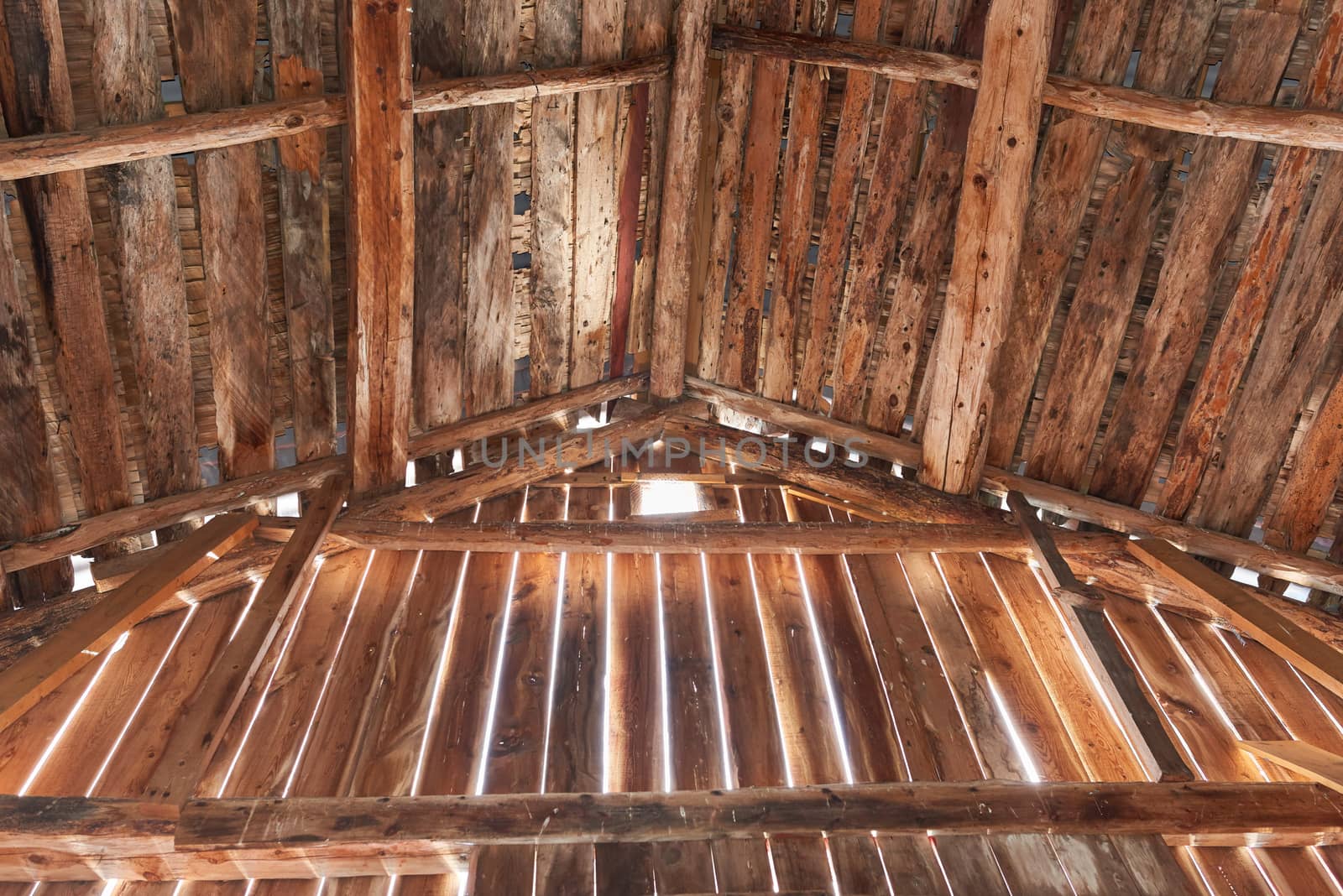 Old barn with sun shining from outside