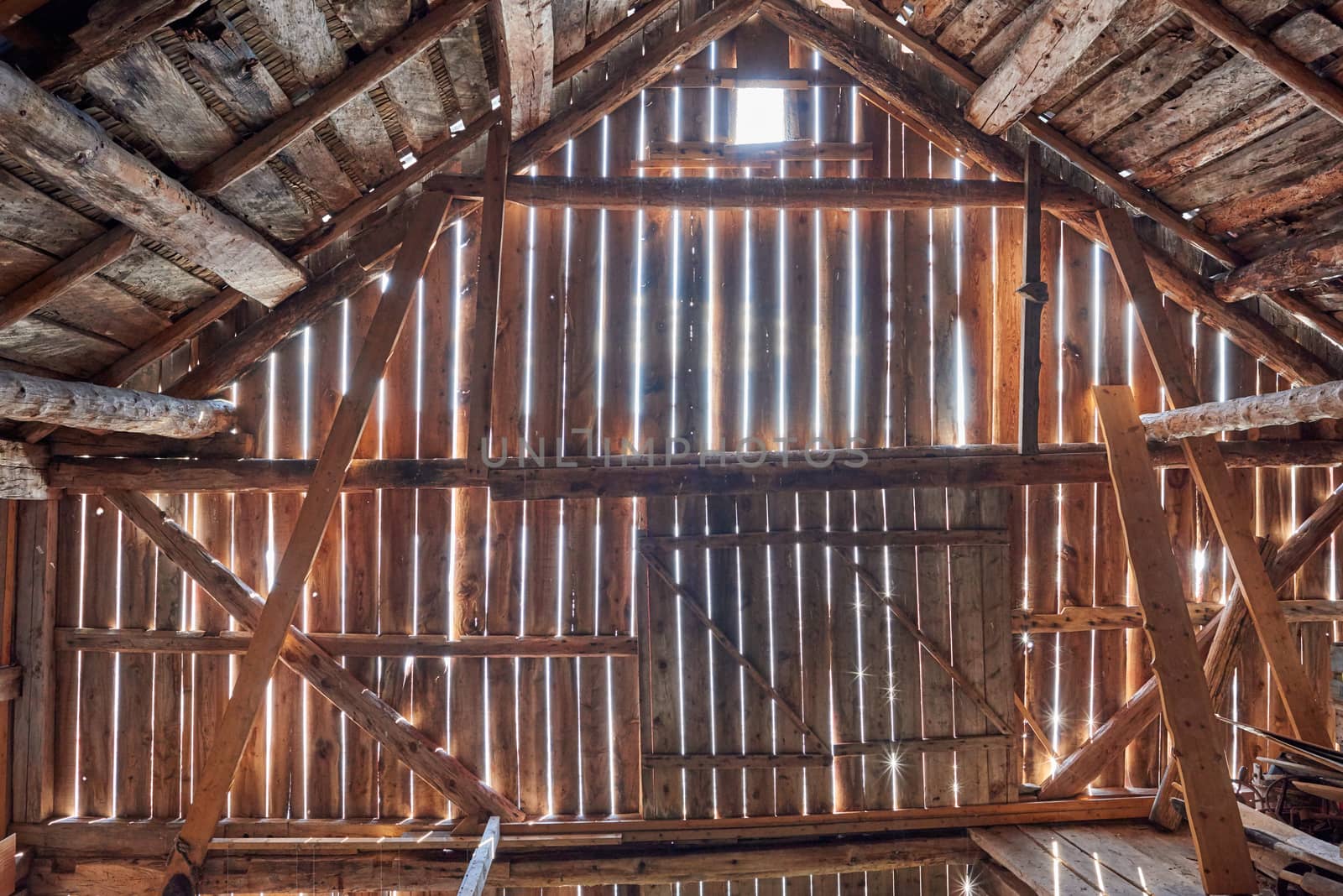 Old barn with sun shining from outside