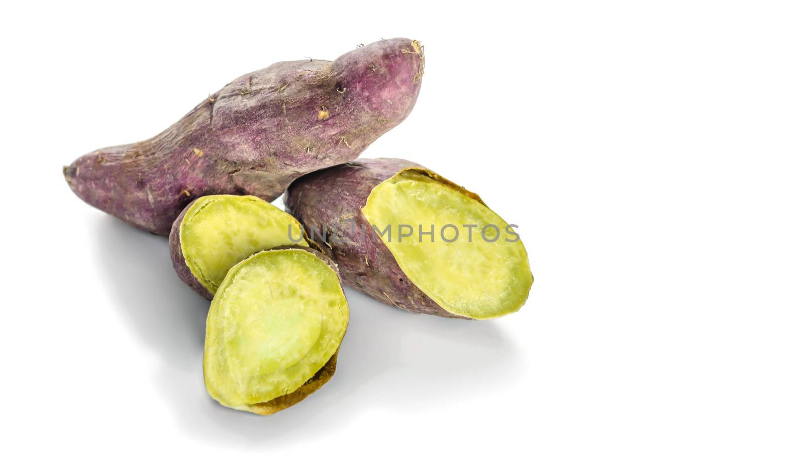 roasted sweet potato with slices isolated on white background