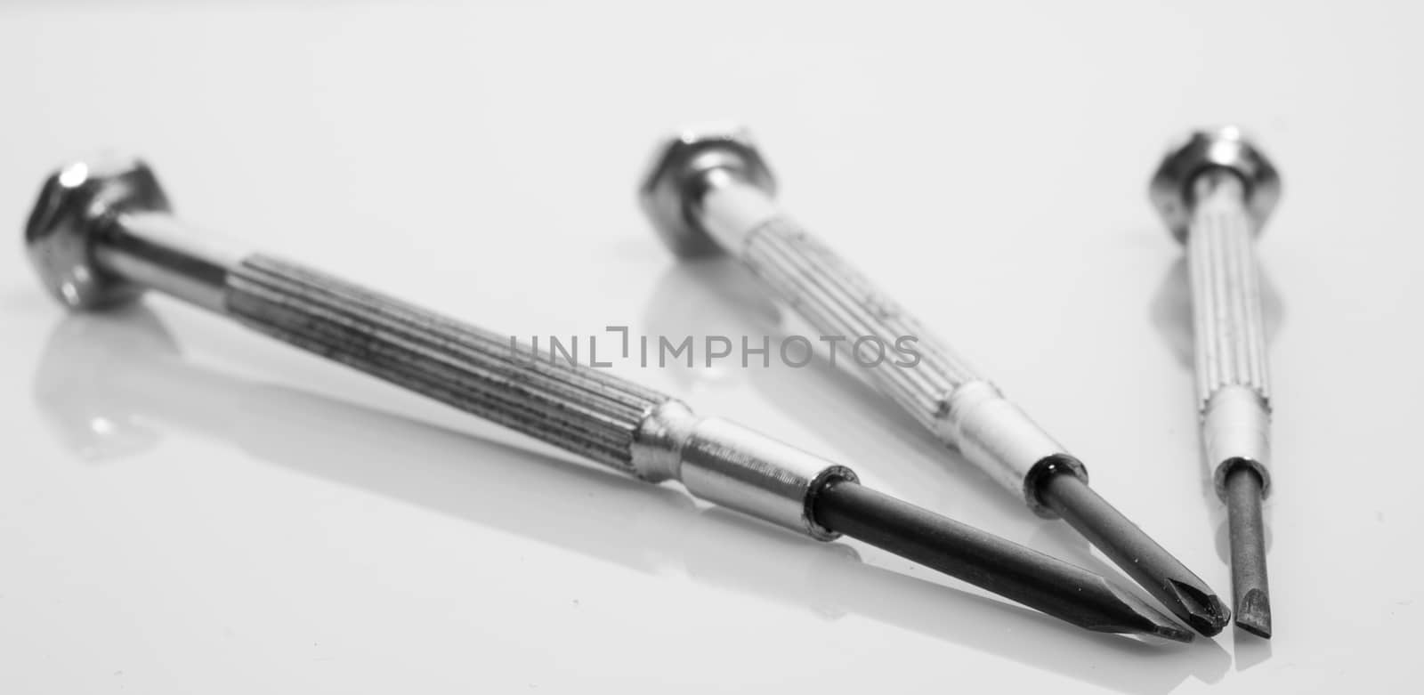 Set of three jewellers scredrivers on a white background with shallow depth of field