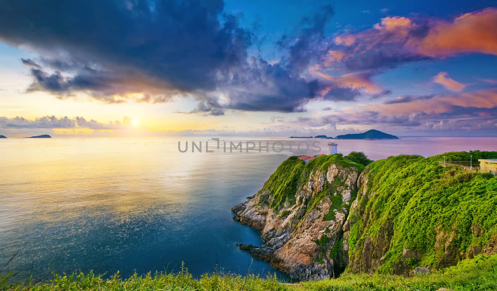 Hong Kong lighthouse during sunrise by cozyta