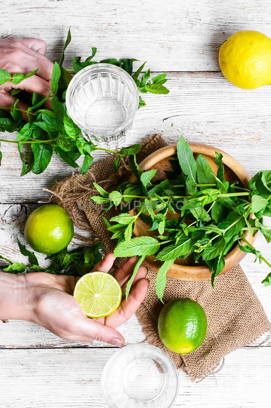 Refreshing cocktail with lime fruit,water, and peppermint