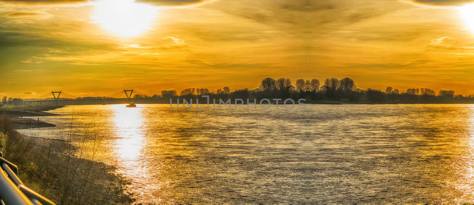 Artistic work of my own. HDR processing.
Panoramic romantic sunset over the Rhein.