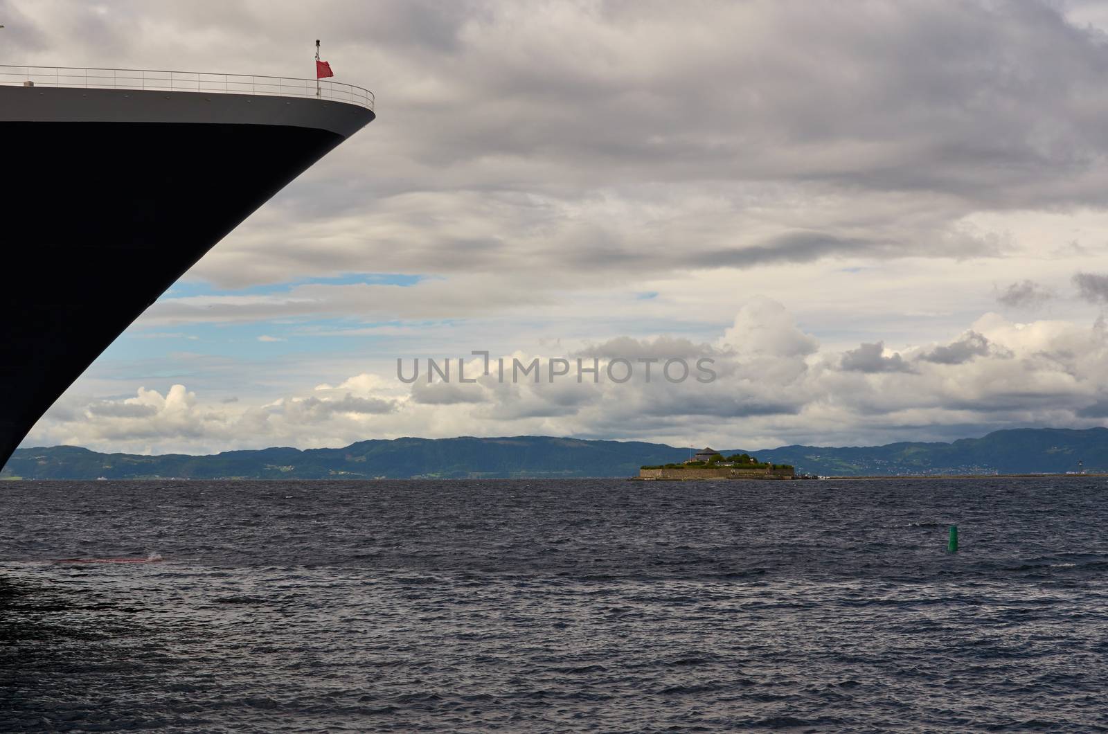 View of Munkholmen, Trondheim, Norway with a cruise ship bow.