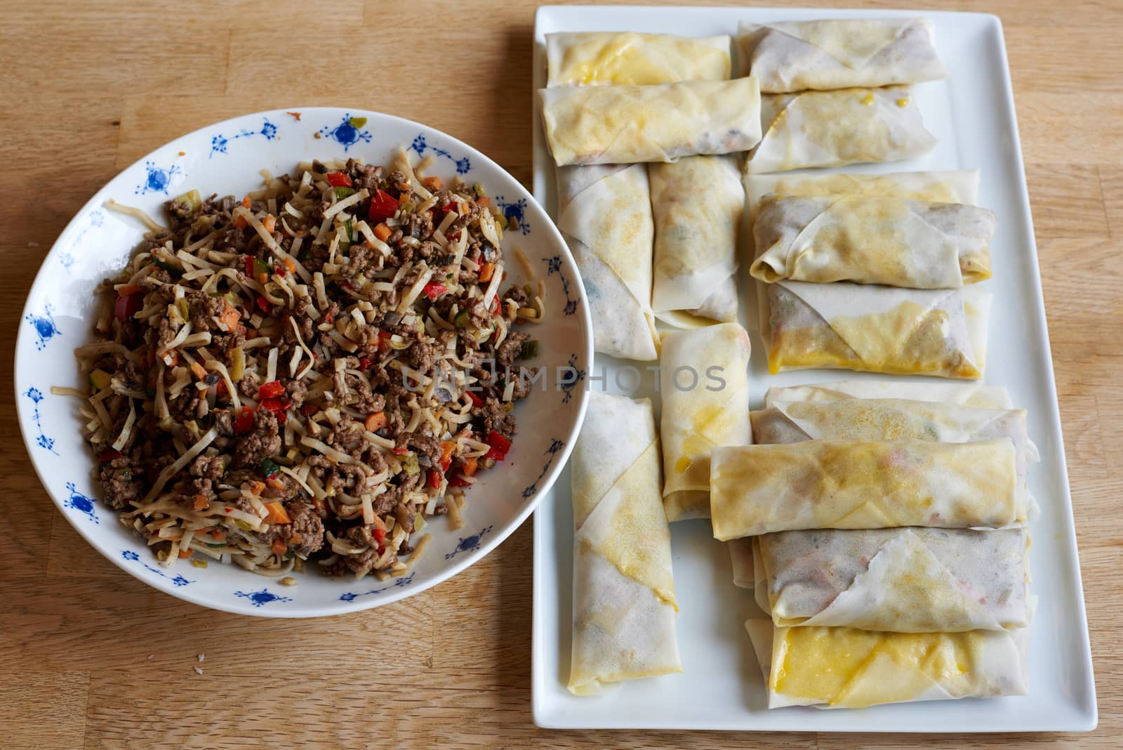 Making of spring rolls before frying.