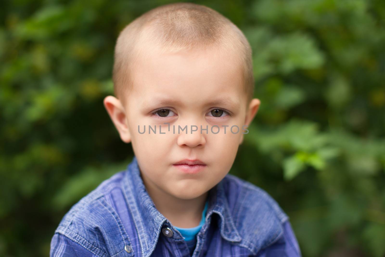Portrait of a boy close up in nature by lanser314