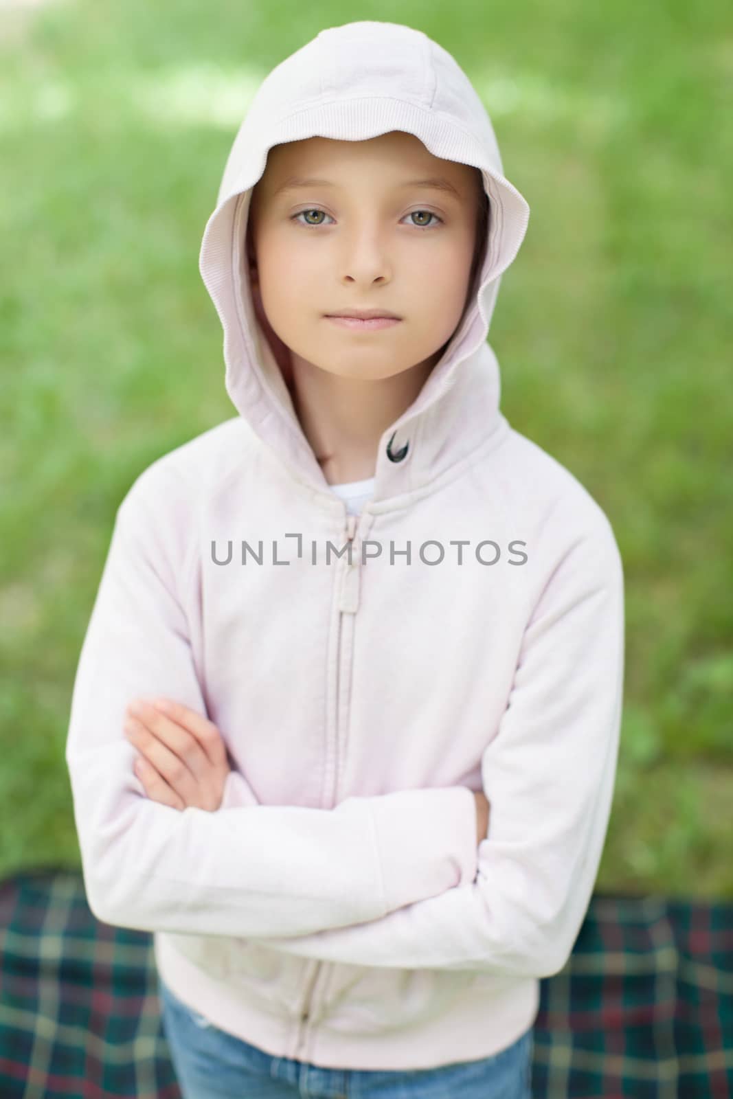 The girl in pink sweater outdoors, portrait