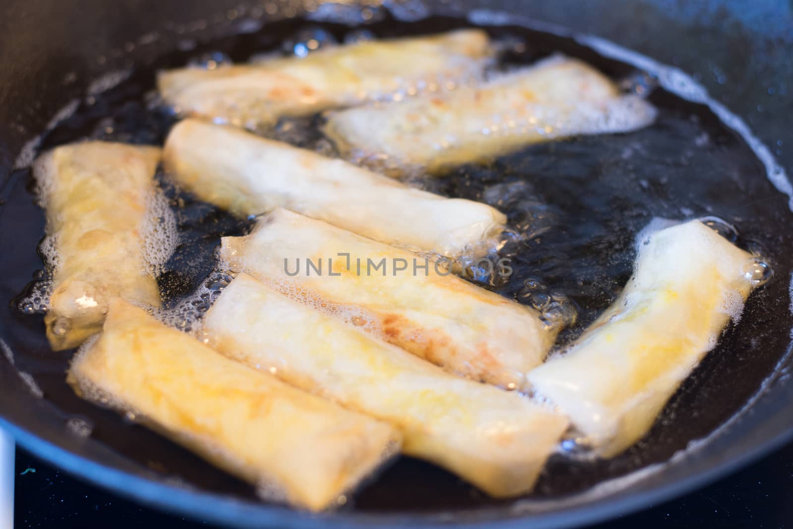 Frying spring rolls in oil