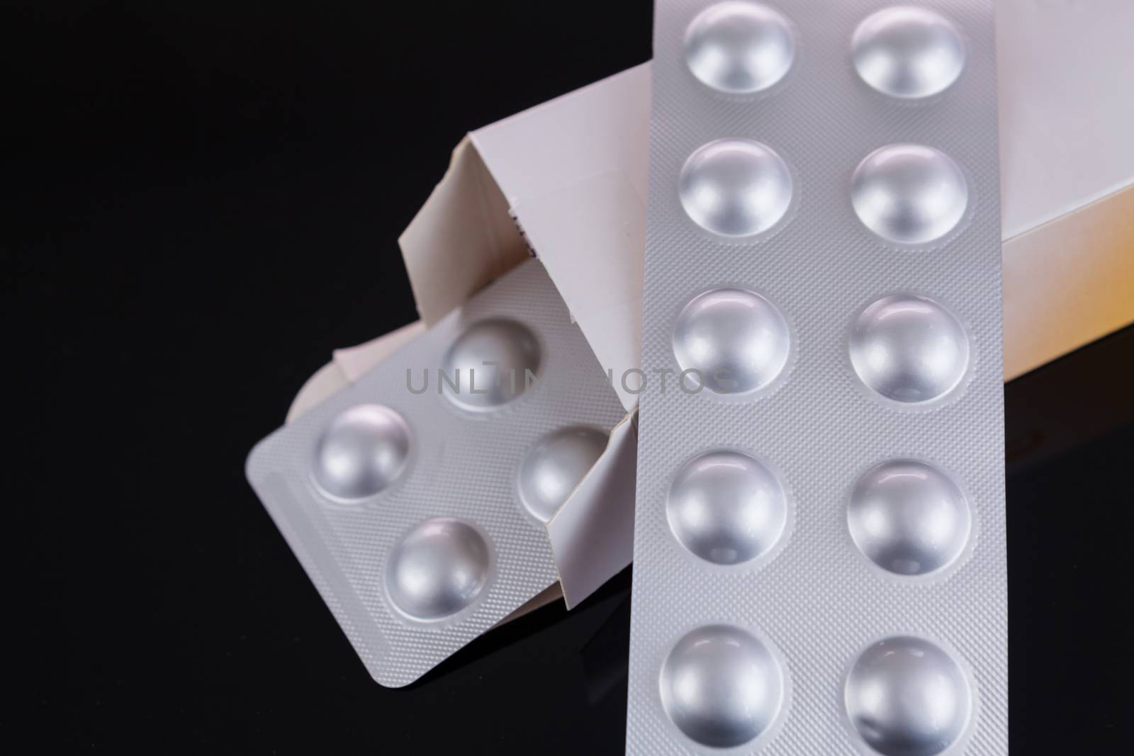 Silver blister pack of small pills by juniart