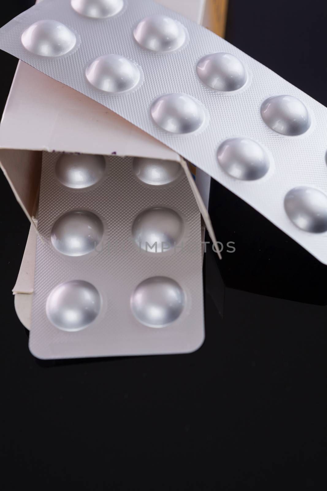 Silver blister pack of small pills by juniart