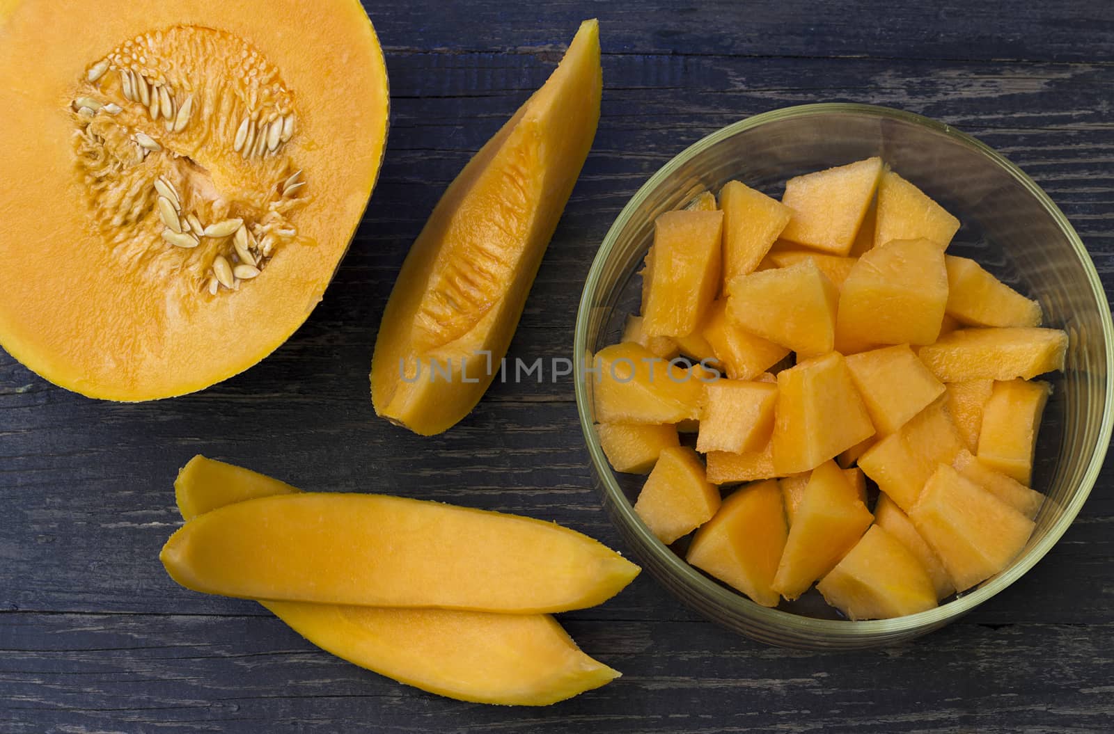 Juicy honeydew melon on a wooden table background