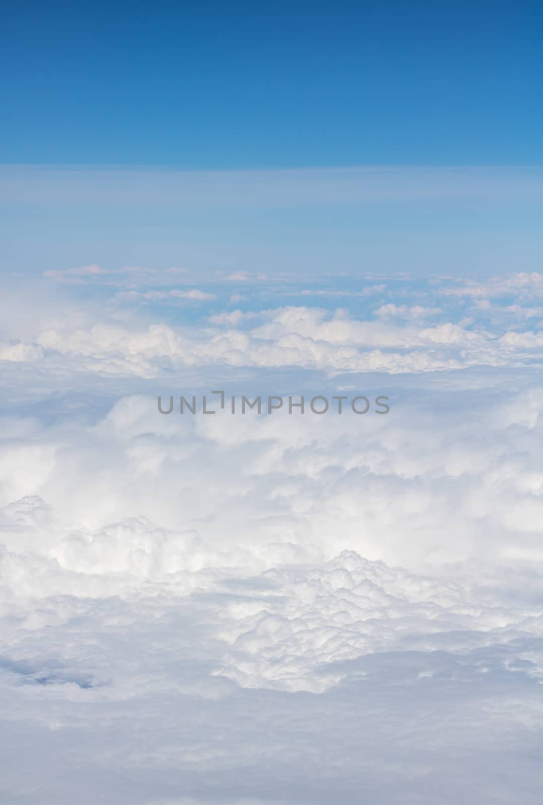 Top view of the fluffy white clouds in the  boundless sky