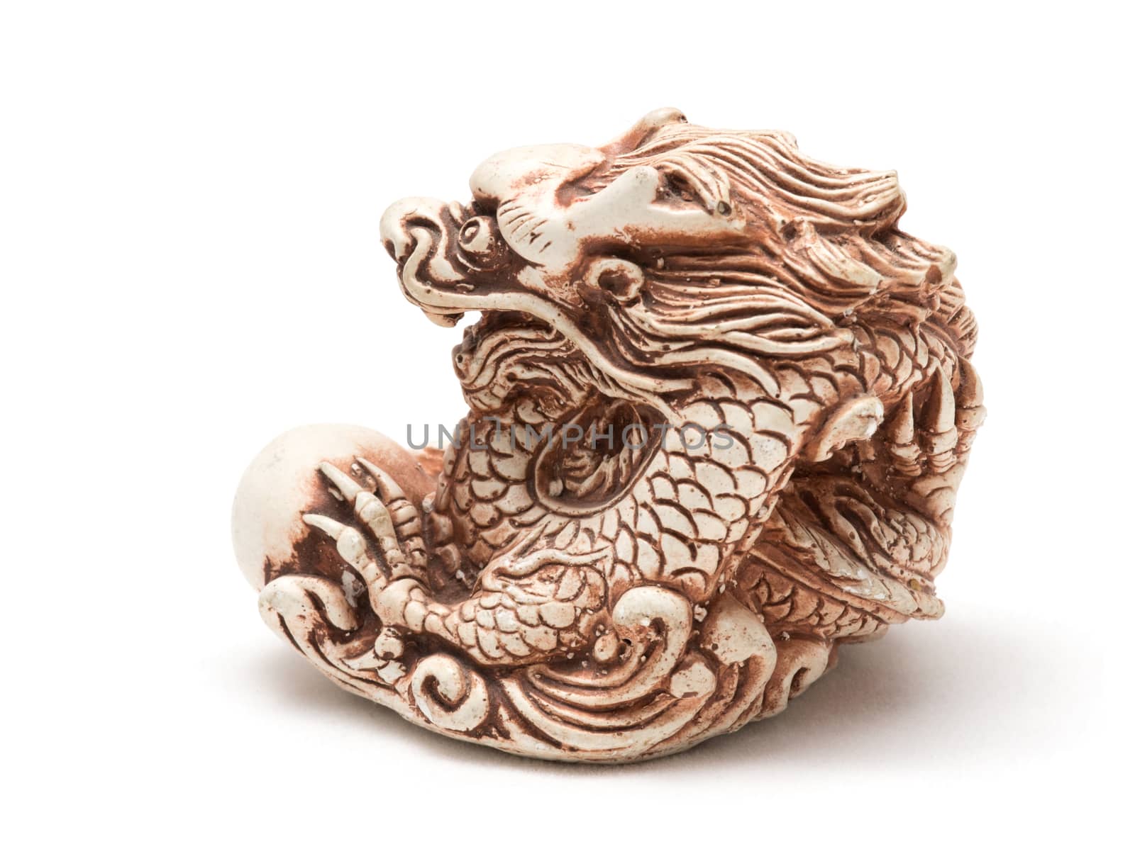 Netsuke of east dragon, which guarding the egg. A miniature sculpture, which was used as a button-like trinket in traditional Japanese clothes kimono kosode, which was devoid of pockets.
