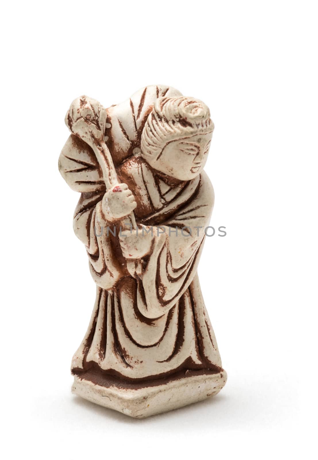 Netsuke of old woman in a dressing gown. A miniature sculpture, which was used as a button-like trinket in traditional Japanese clothes kimono kosode, which was devoid of pockets.