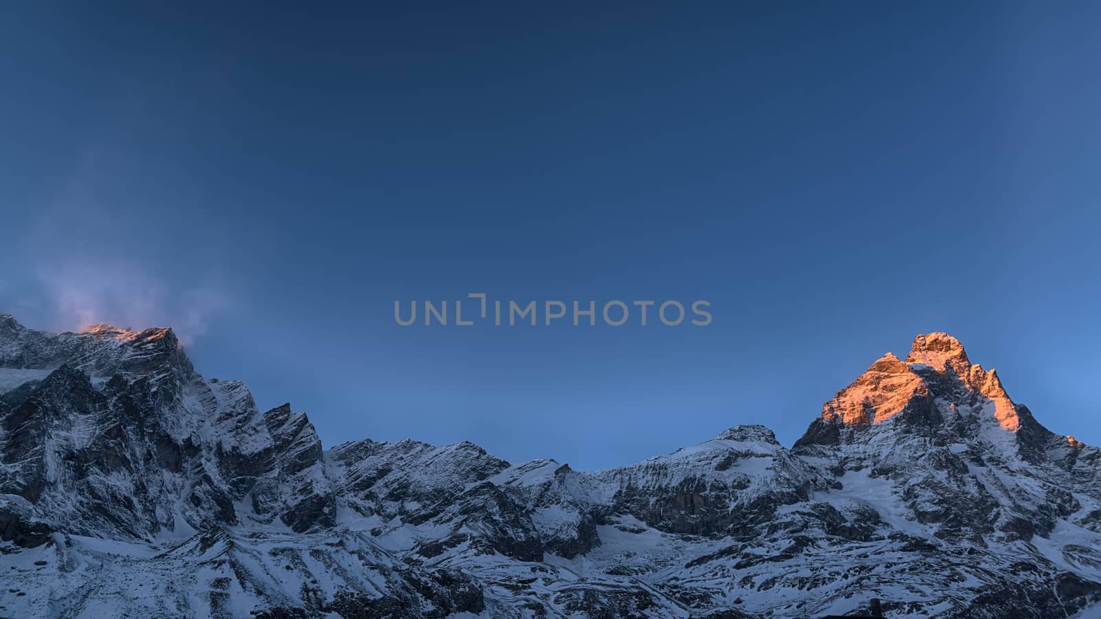 Last rays of sun on the top of the Mount Cervino in winter season, Aosta Valley - Italy