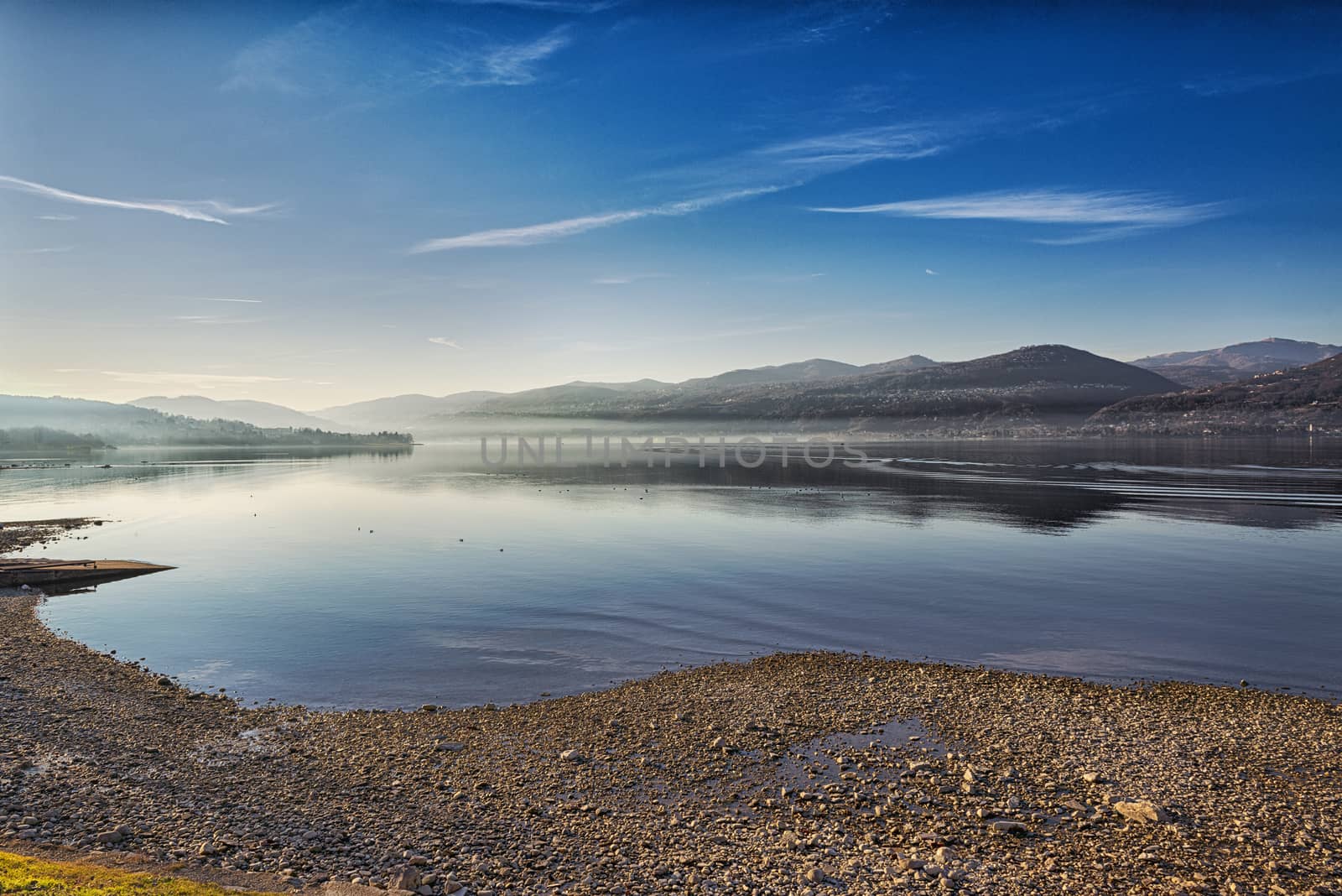 Landscape on the Major Lake in a quiet winter afternoon with fog at the horizon, Ispra - Varese, Lombardy - Italy