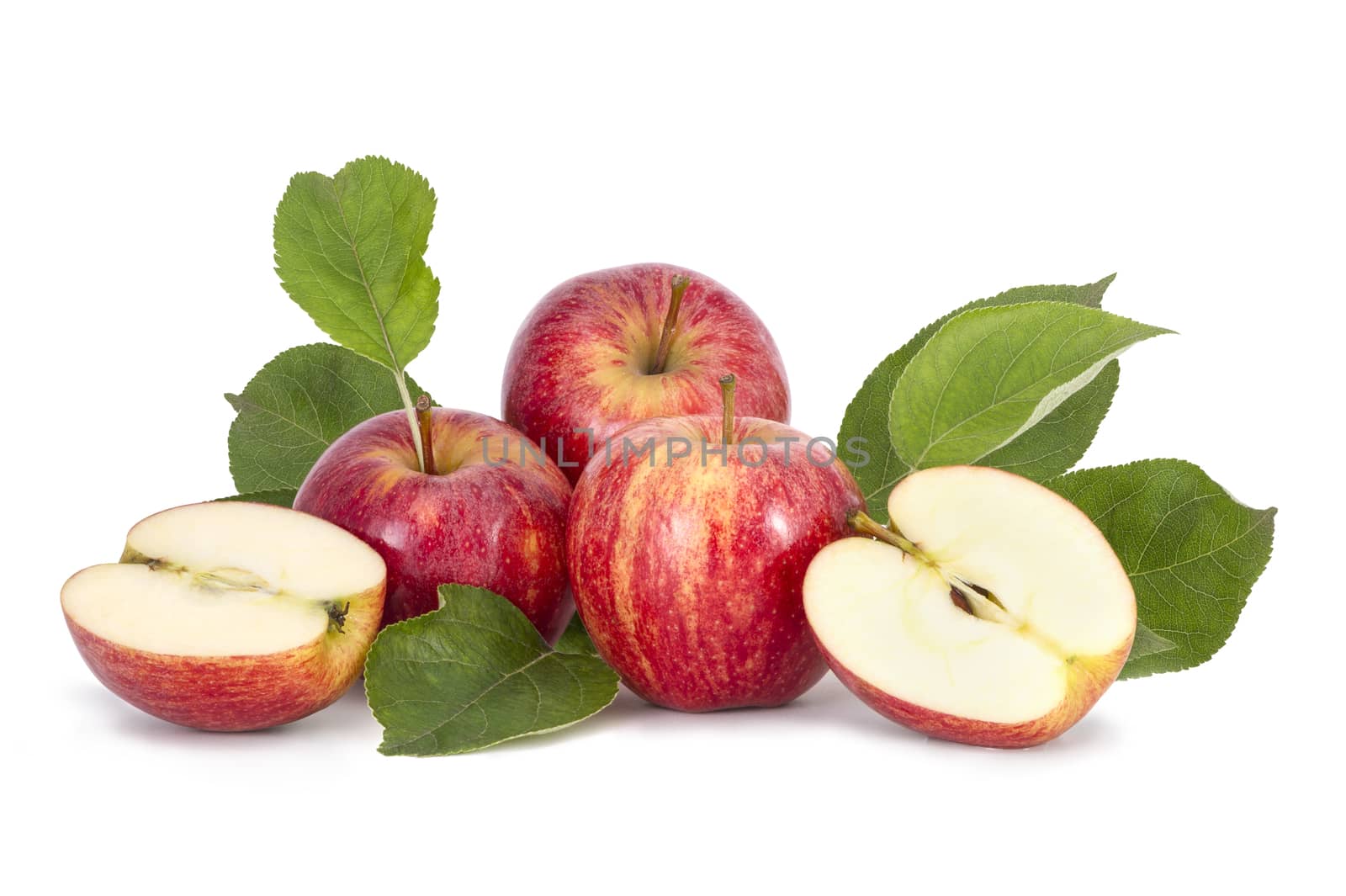 Red apples with green leaves on white background