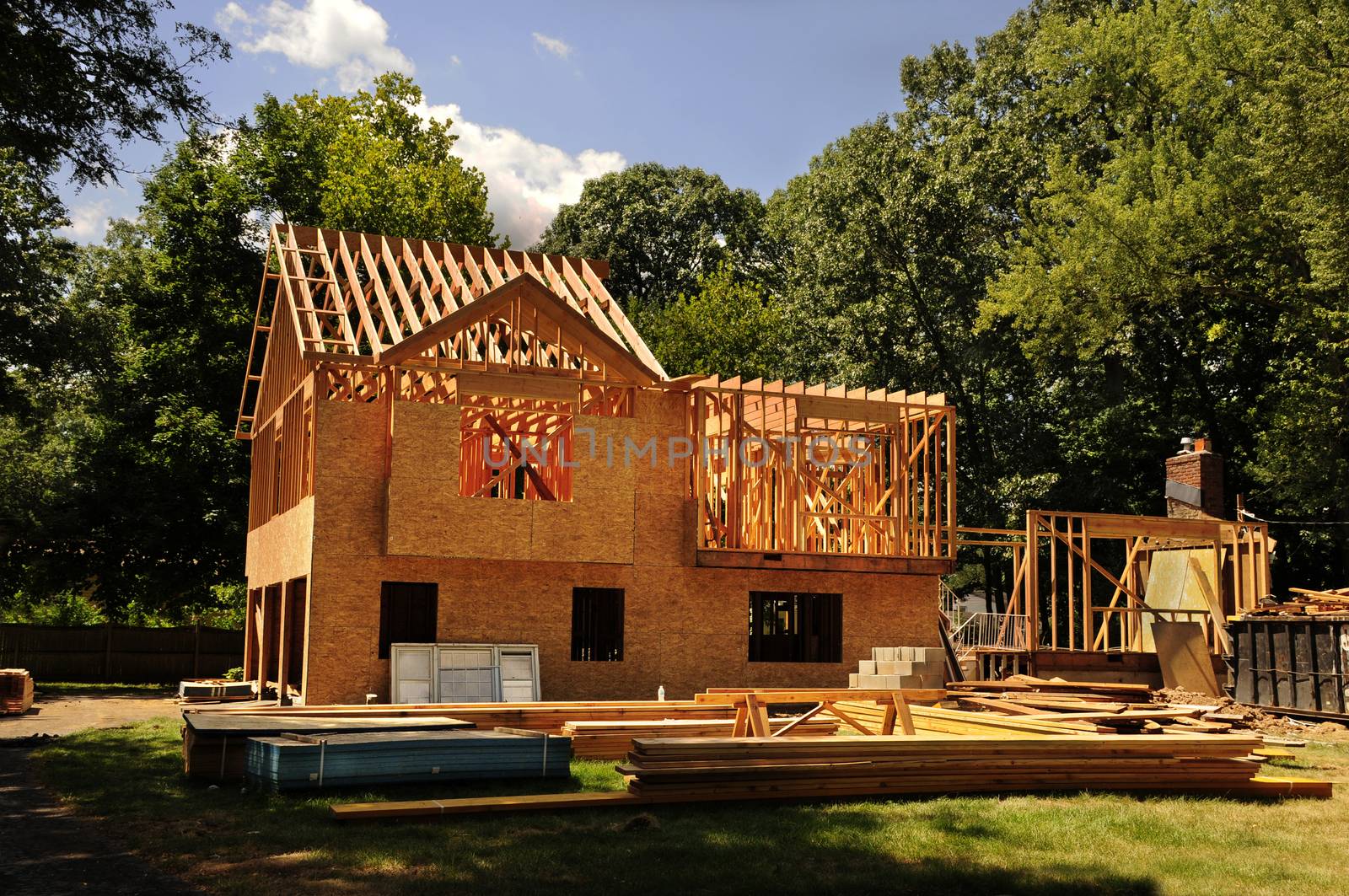 A residential home under construction mid framing and sheathing by Balefire9