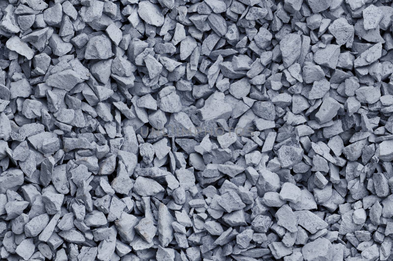 Bluish gray gravel used for construction fill, seamless background texture