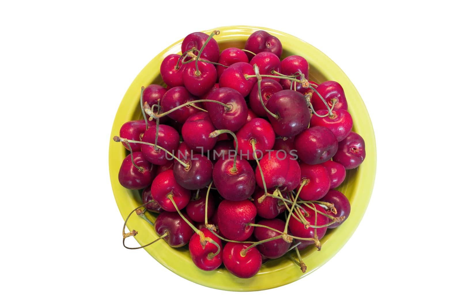 Top View of Pile of Bing Cherries in Green Bowl Isolated on white background