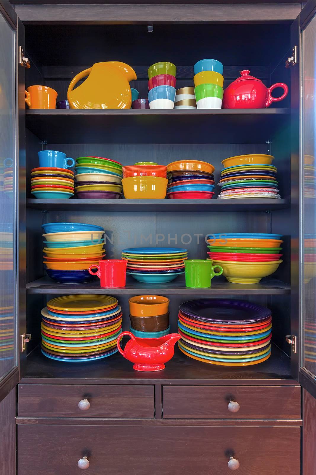 Colorful Stoneware Dinnerware in China Cabinet by jpldesigns