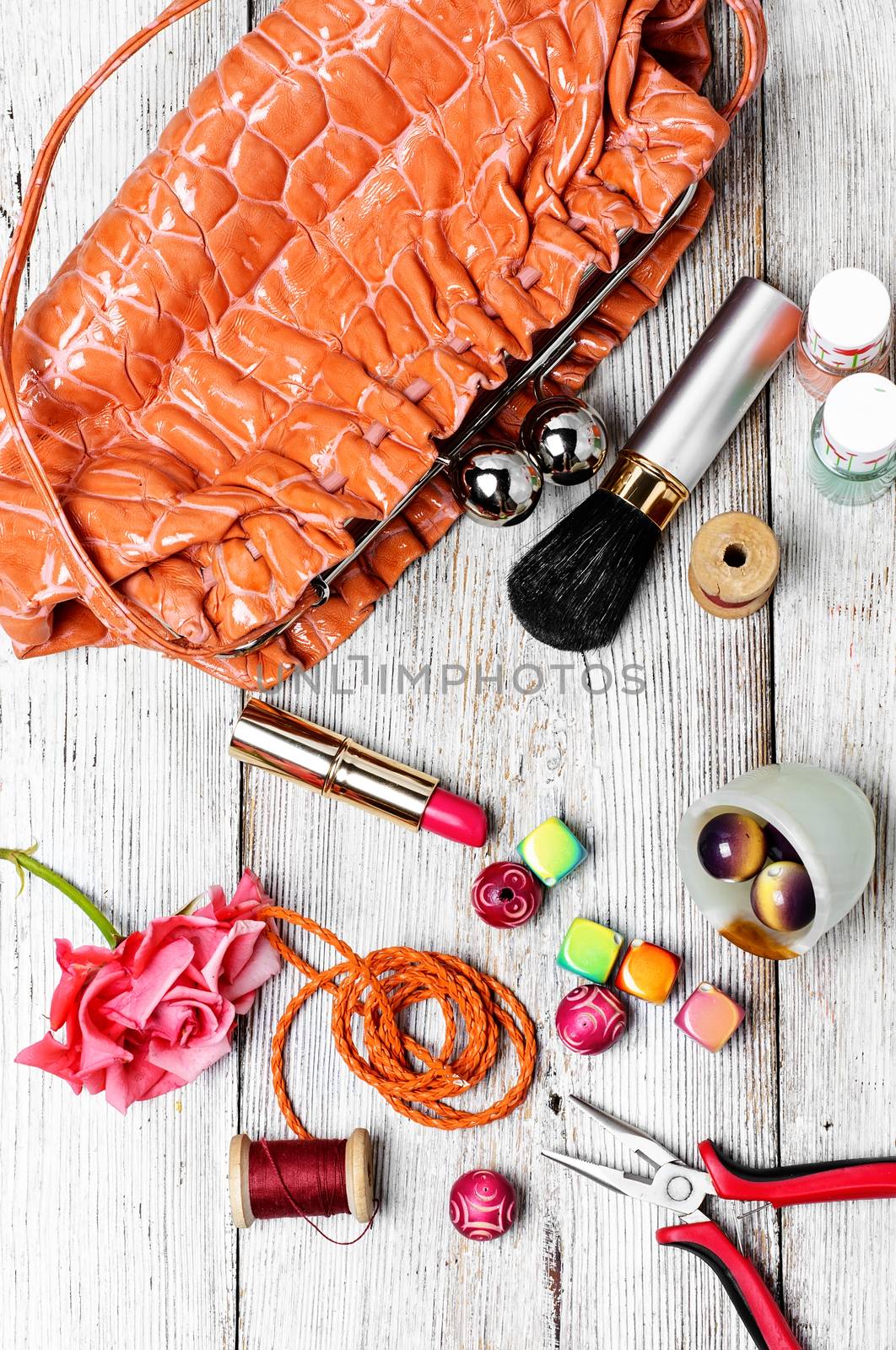 beads for jewelry and womens tote bag with cosmetics