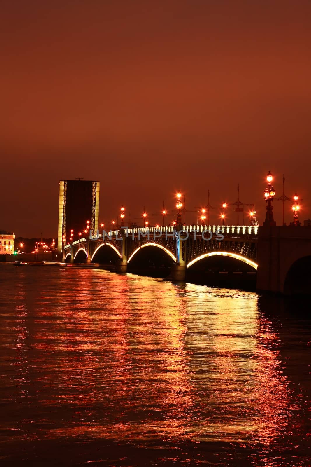 View of drawbridge across Neva river in Saint Petersburg at night, Russia