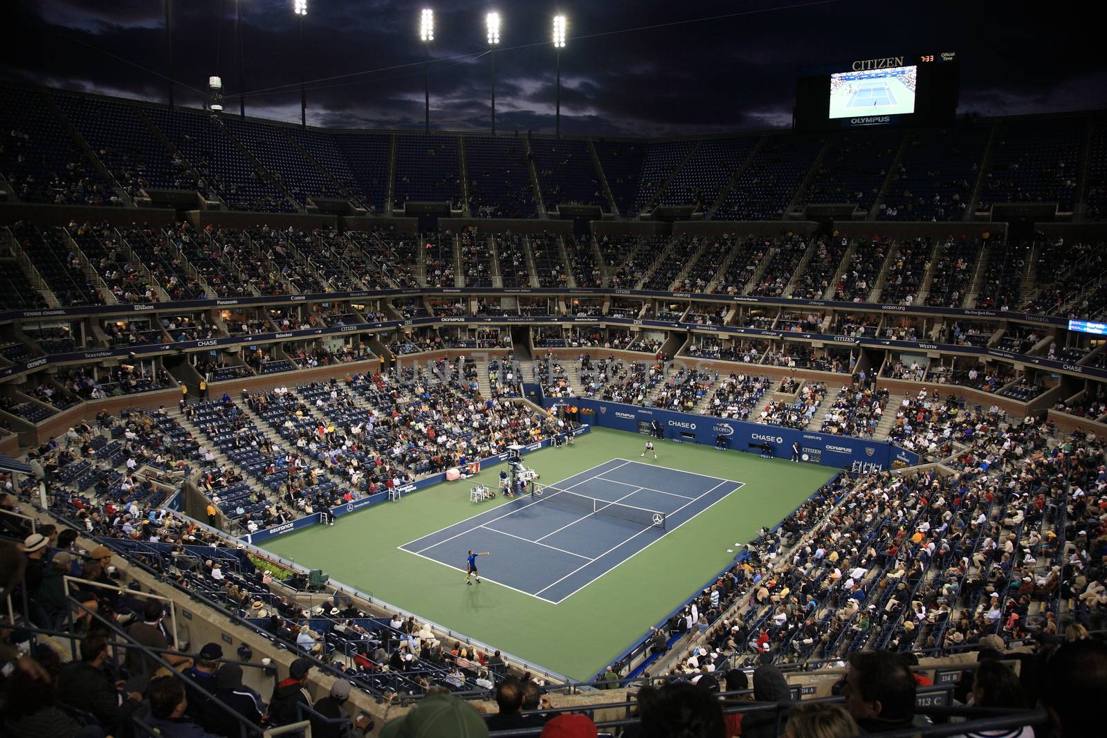 A crowded Arthur Ashe Stadium for a night U.S. Open tennis match in Queens, New York City.