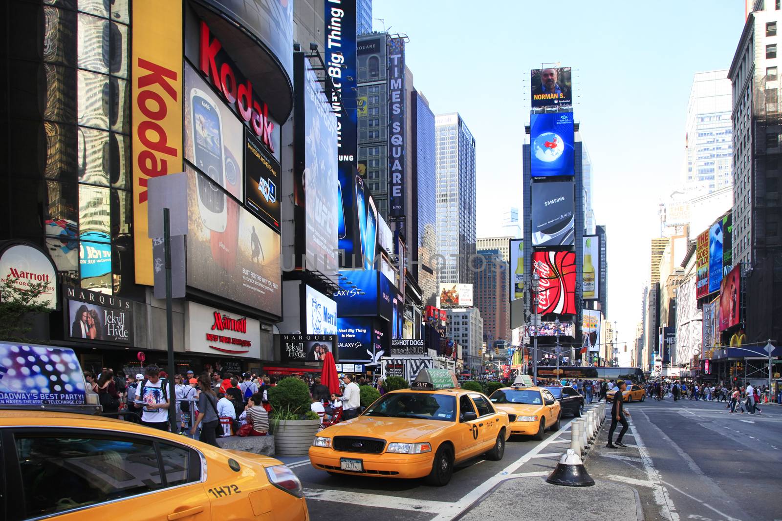 New York, NY, USA - May 17, 2013: Times Square, featured with Broadway Theaters and huge number of LED signs, is a symbol of New York City and the United States, May 17, 2013 in Manhattan, New York City