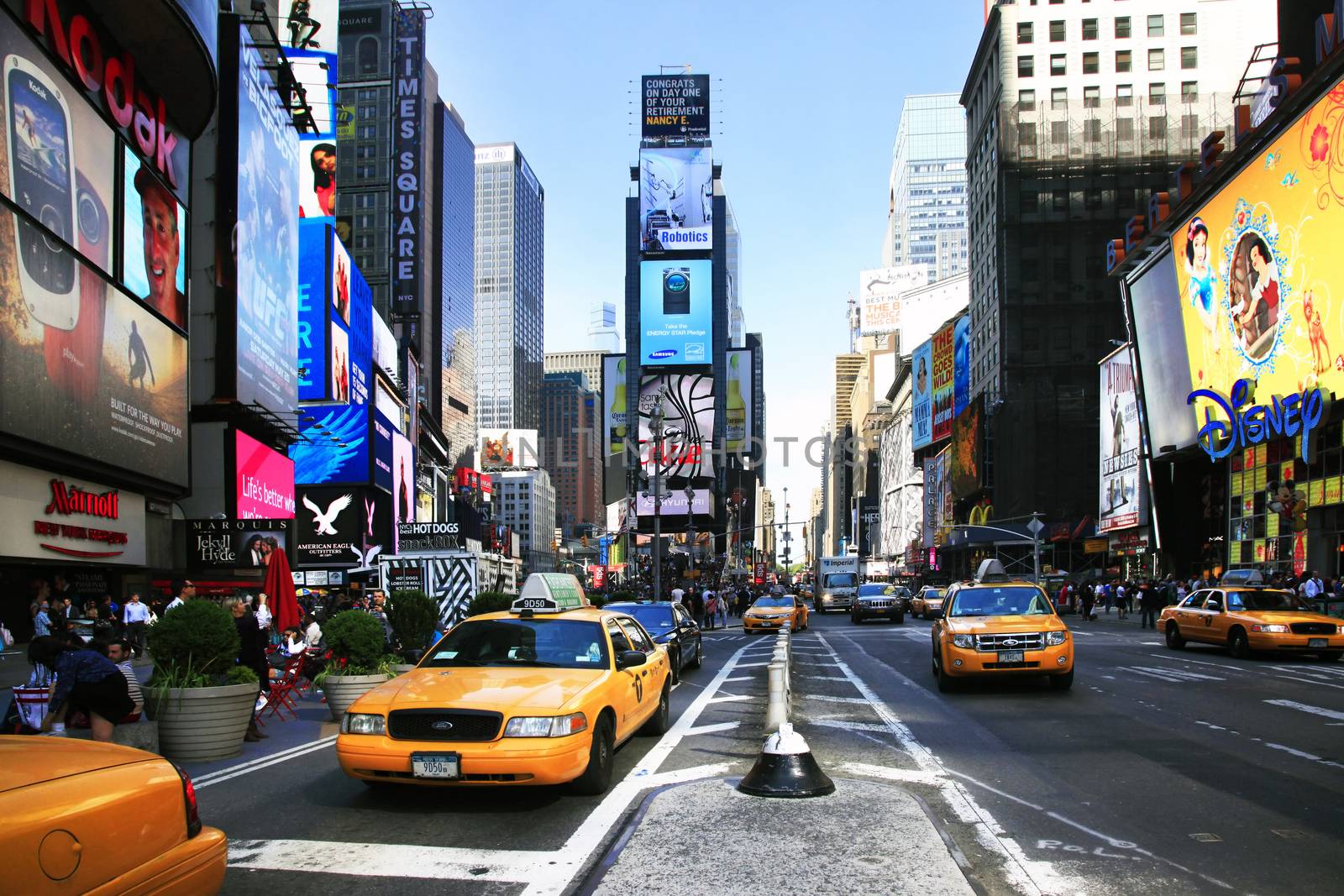 New York, NY, USA - May 17, 2013: Times Square, featured with Broadway Theaters and huge number of LED signs, is a symbol of New York City and the United States, May 17, 2013 in Manhattan, New York City