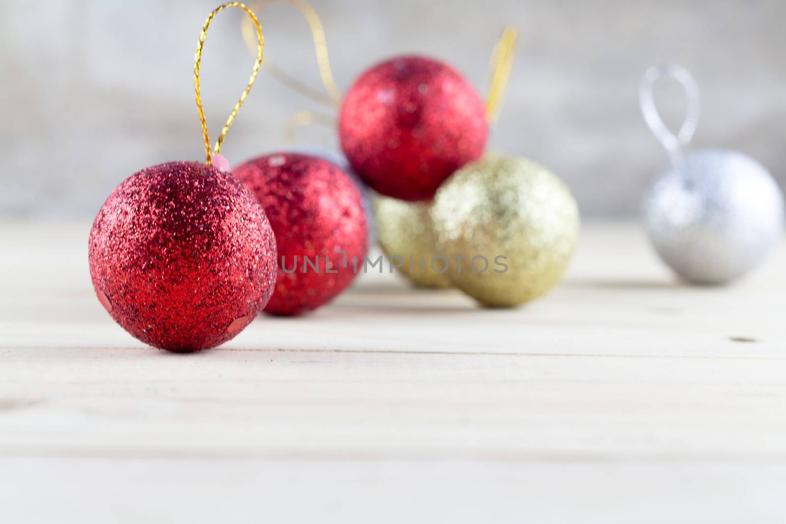 Christmas decoration with bauble ball on wooden table background