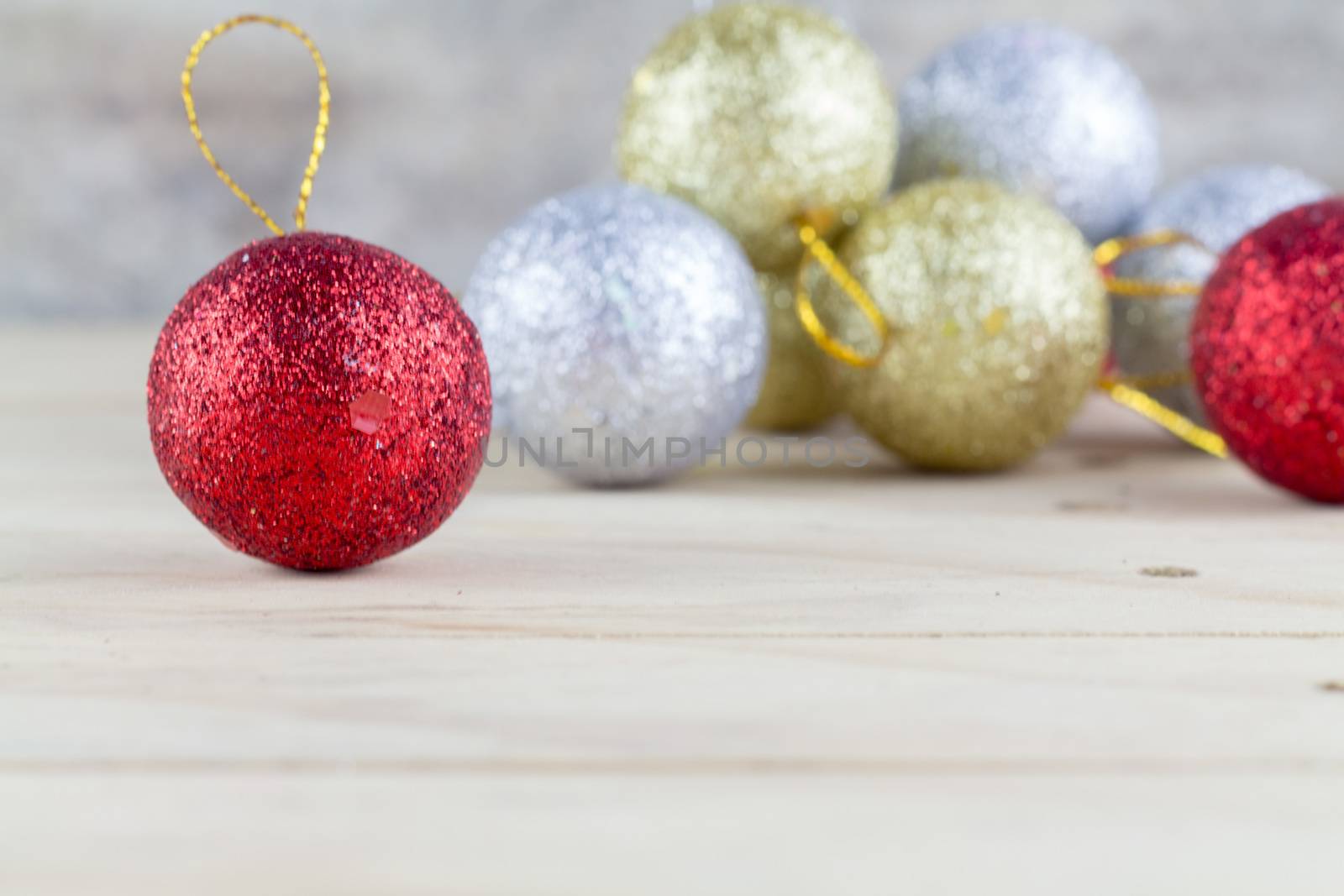 Christmas decoration with bauble ball on wooden table background