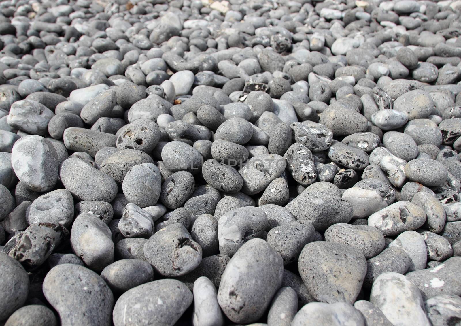 Grey Rubble Beach Stones with Endless Perspective Background