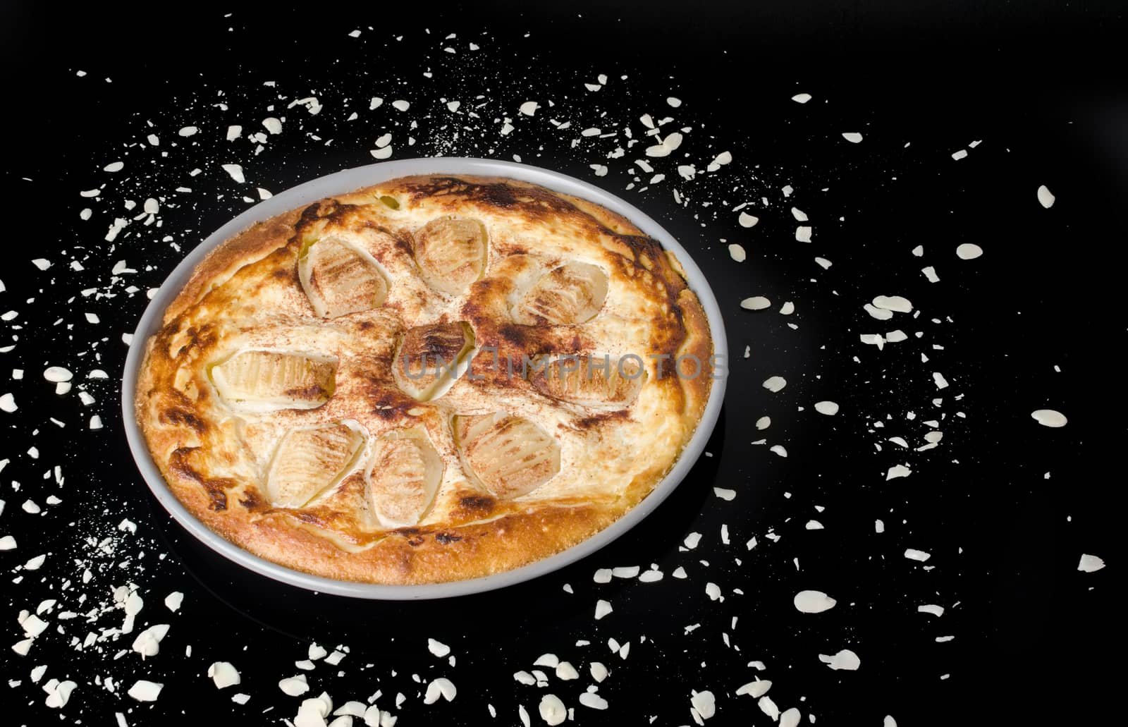 Sweet tasty pear pie isolated on black background