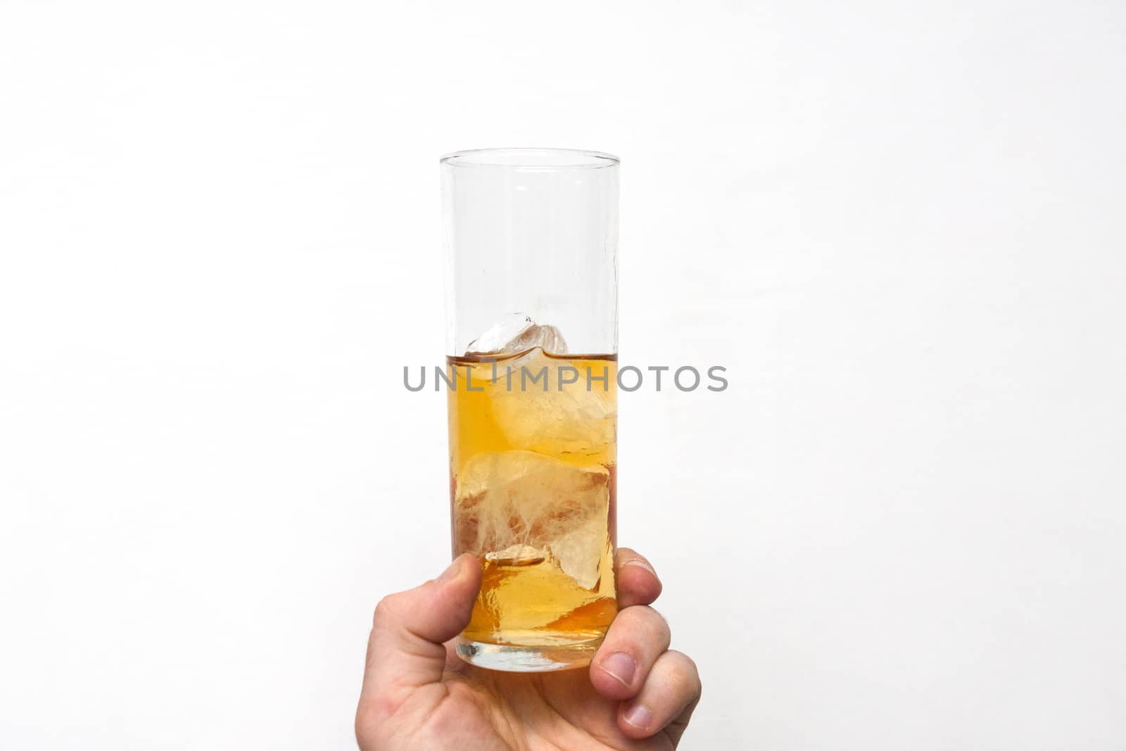 man holding glass of alcoholic drink