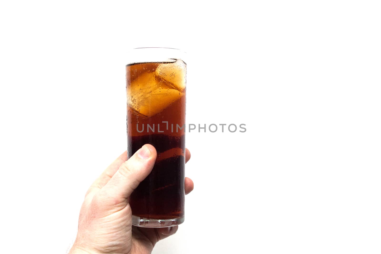 man holding glass of alcoholic drink