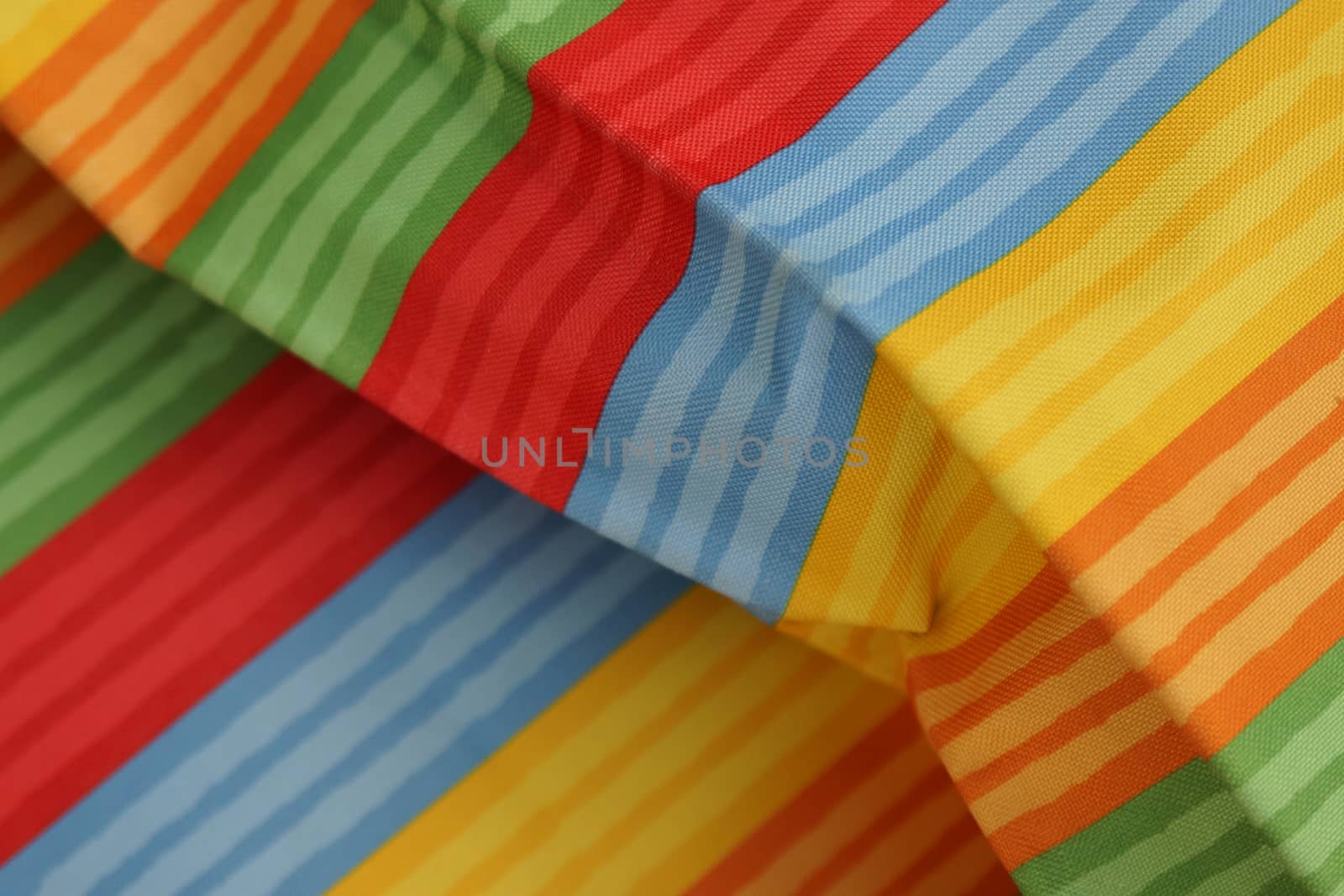 Abstract colorful background stripe textile texture. Macro photo.