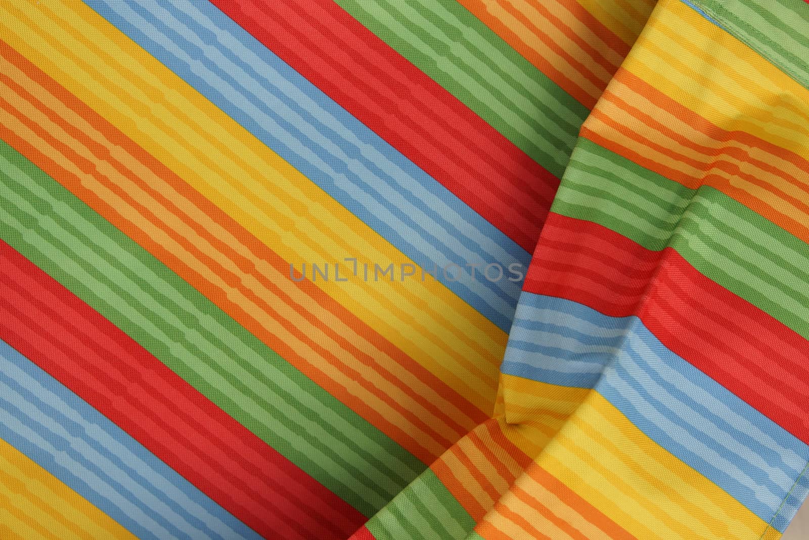 Abstract colorful background stripe textile texture. Macro photo.