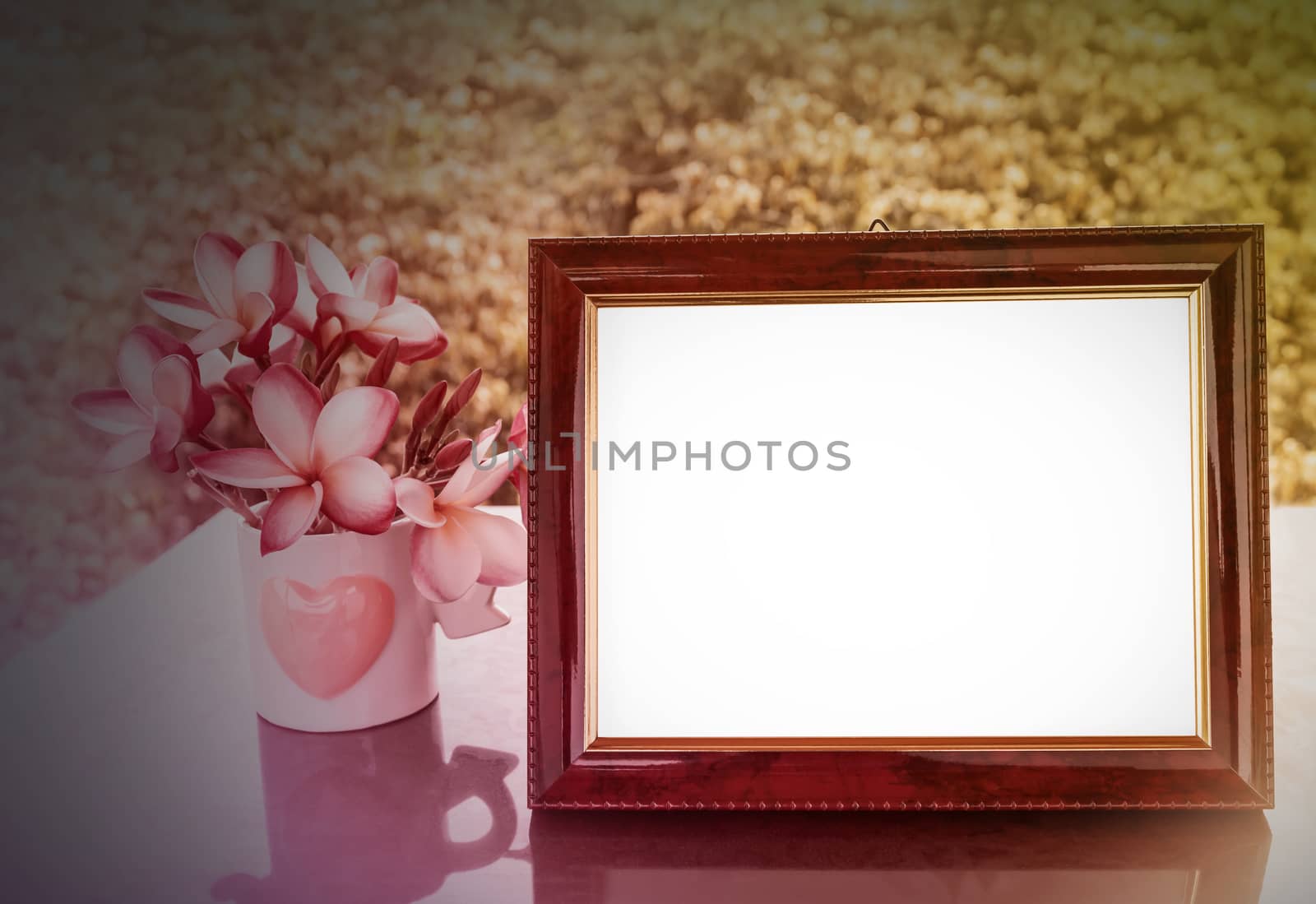 Vintage mood classic burnt dark brown colour blank picture frame with flowers and tree background