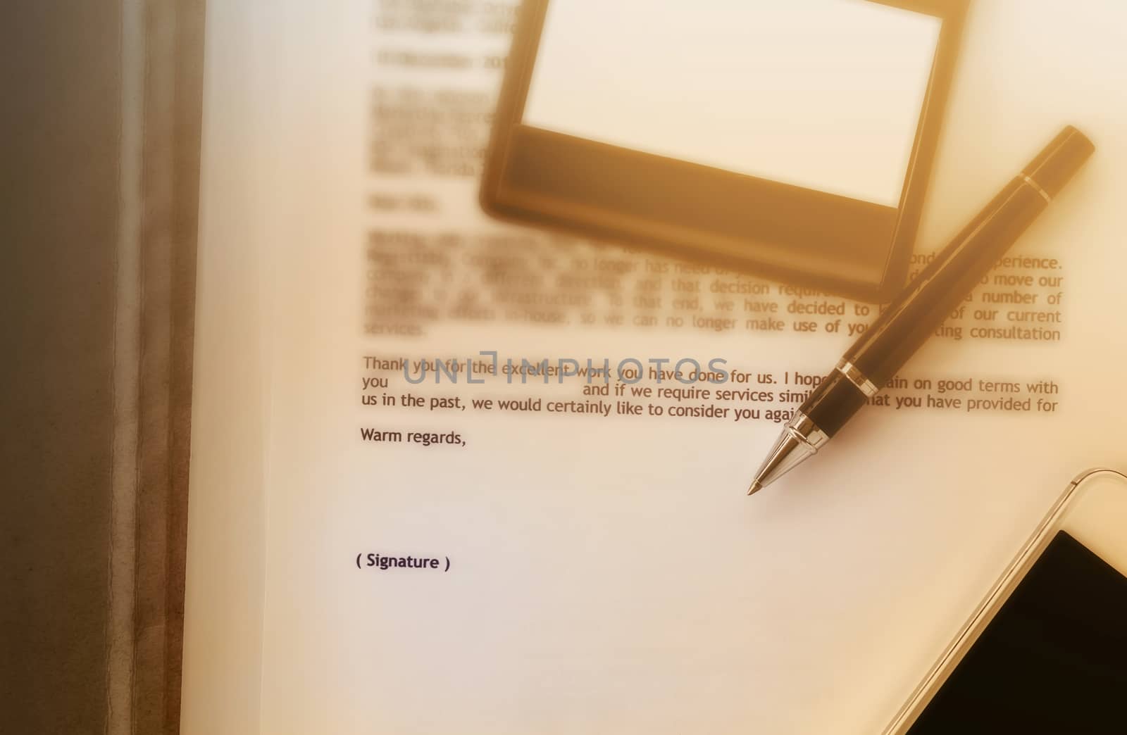 Blurred business letter document with pen and blank area for text signature, job well done, admire letter