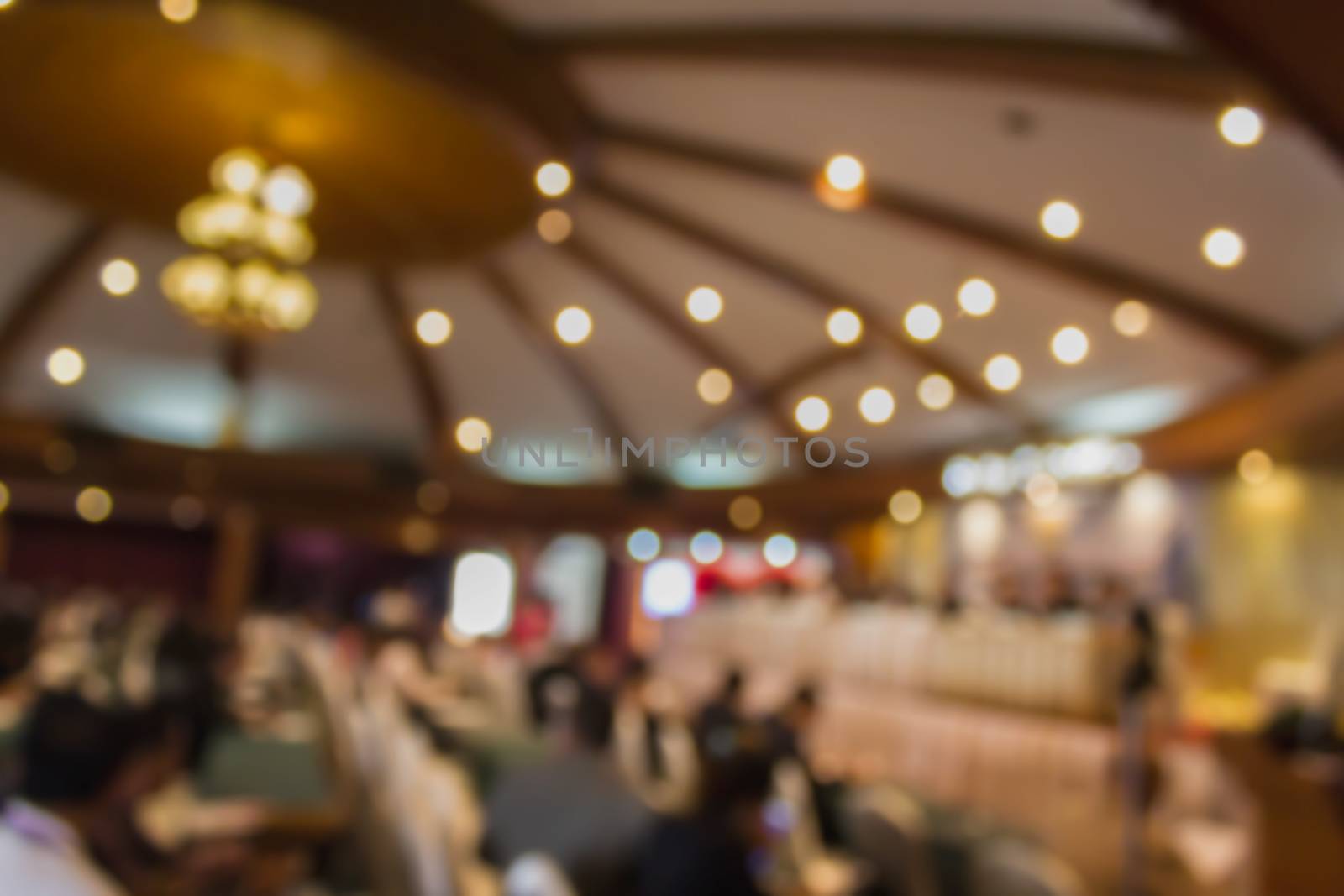 Blurred background people in convention or meeting room with bokeh light
