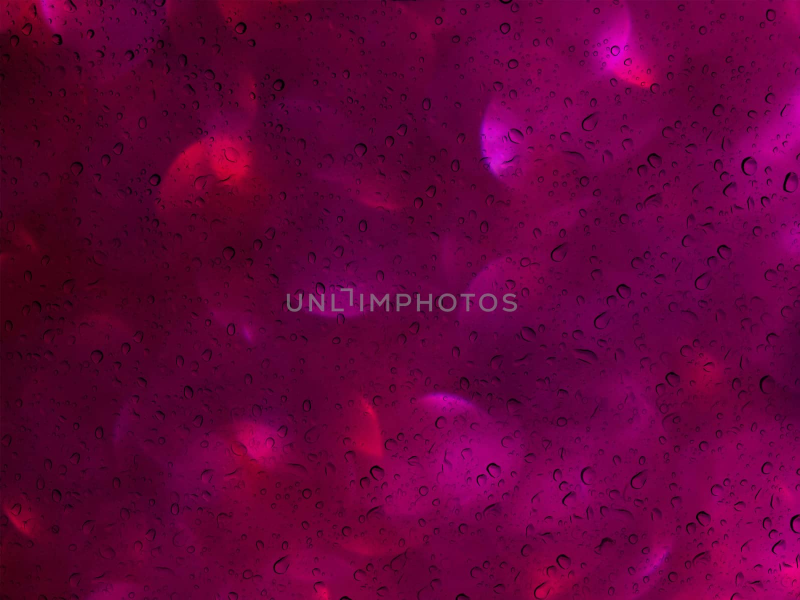 Romantic violet pink soft red bokeh and water drop on glass mirror plate abstract valentine background