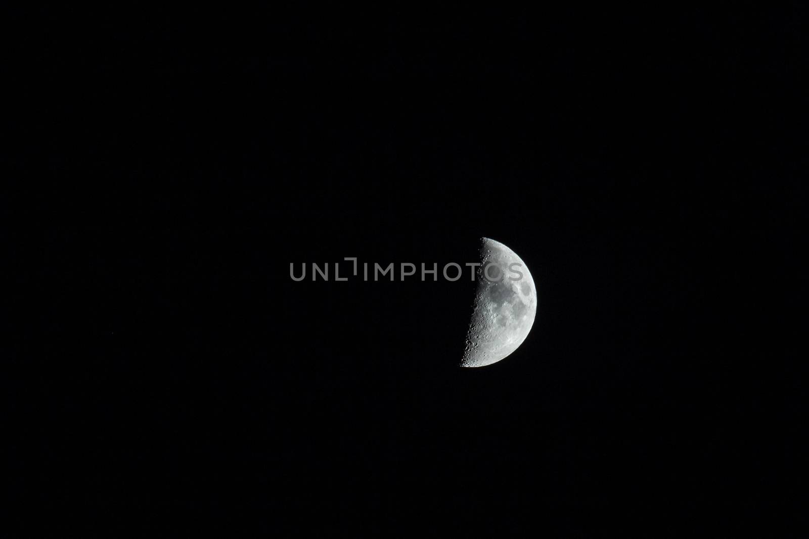 The silver half moon isolated on black. .