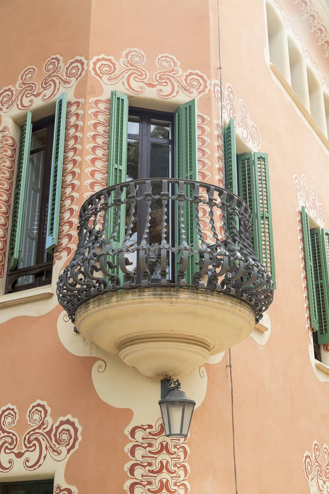 BARCELONA , SPAIN - MAY 13, 2016 : Facade with metal balcony on Gaudi House Museum. Building  located near the Park Guell  in Barcelona was the residence of Antoni Gaudi for almost 20 years, from 1906 to 1925.