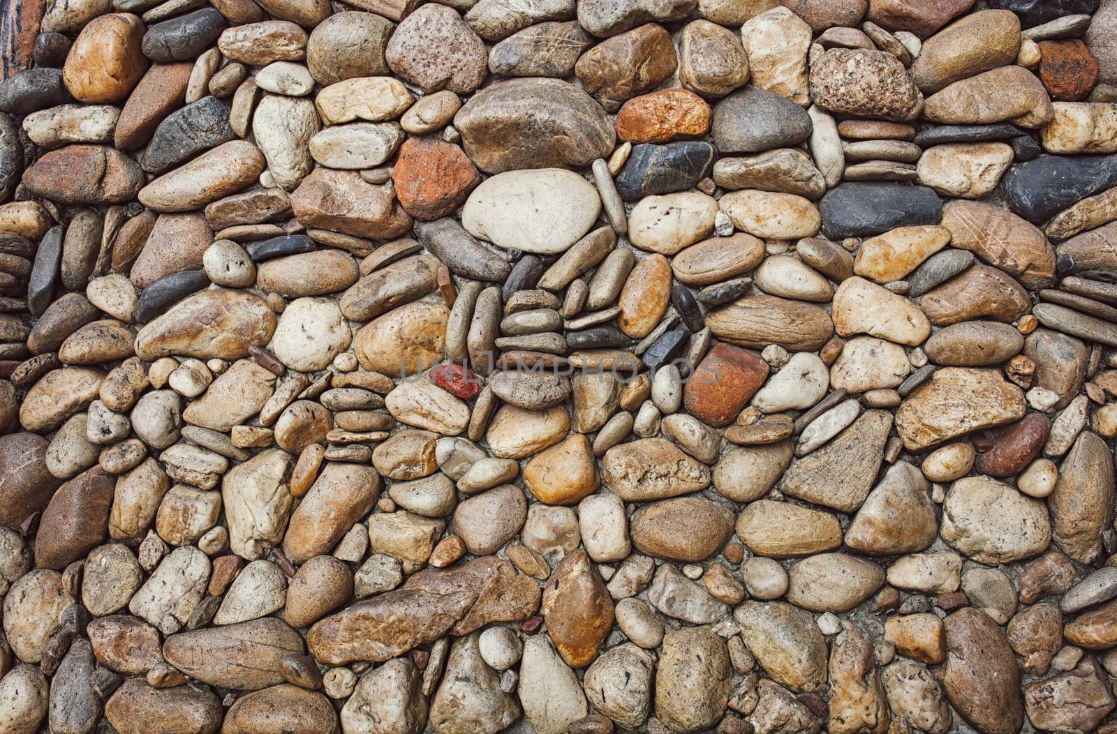 Sea stones pebble texture background .