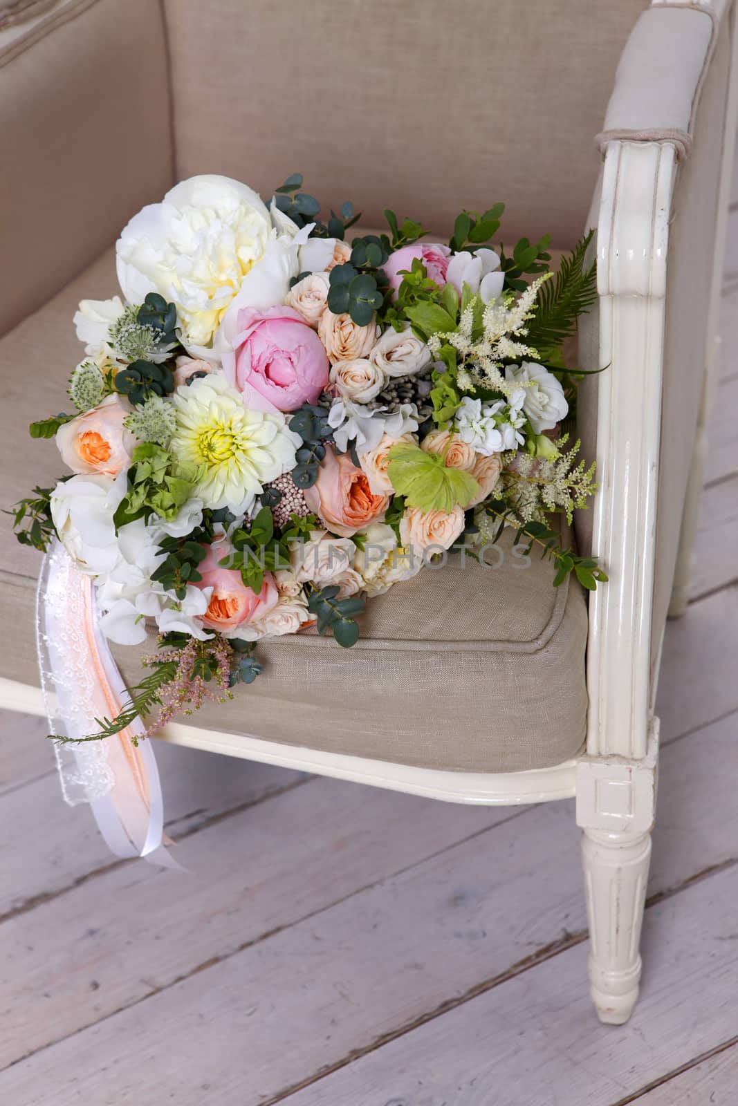 Beautiful wedding bouquet, forgotten on a vintage chair