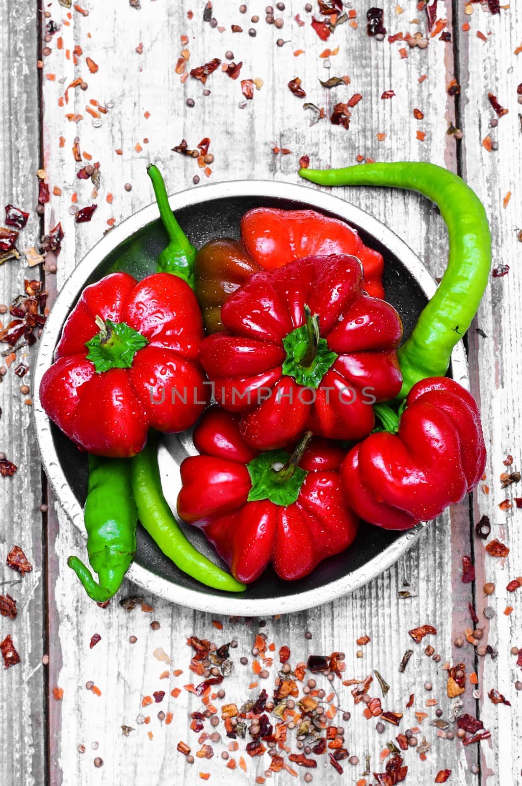 Set of red pepper and paprika on iron plate with bright light background with spices
