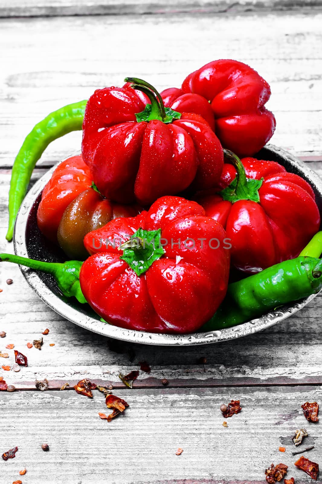 Set of red pepper and paprika on iron plate with bright light background with spices