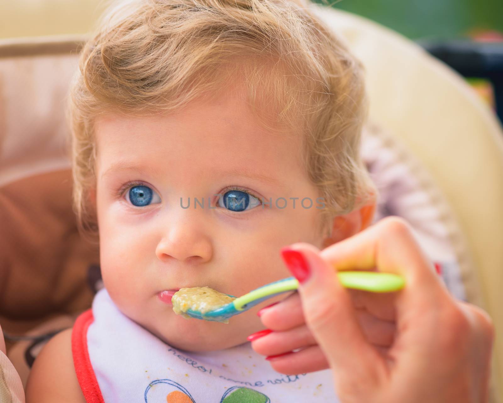 Baby boy eating food by Robertobinetti70