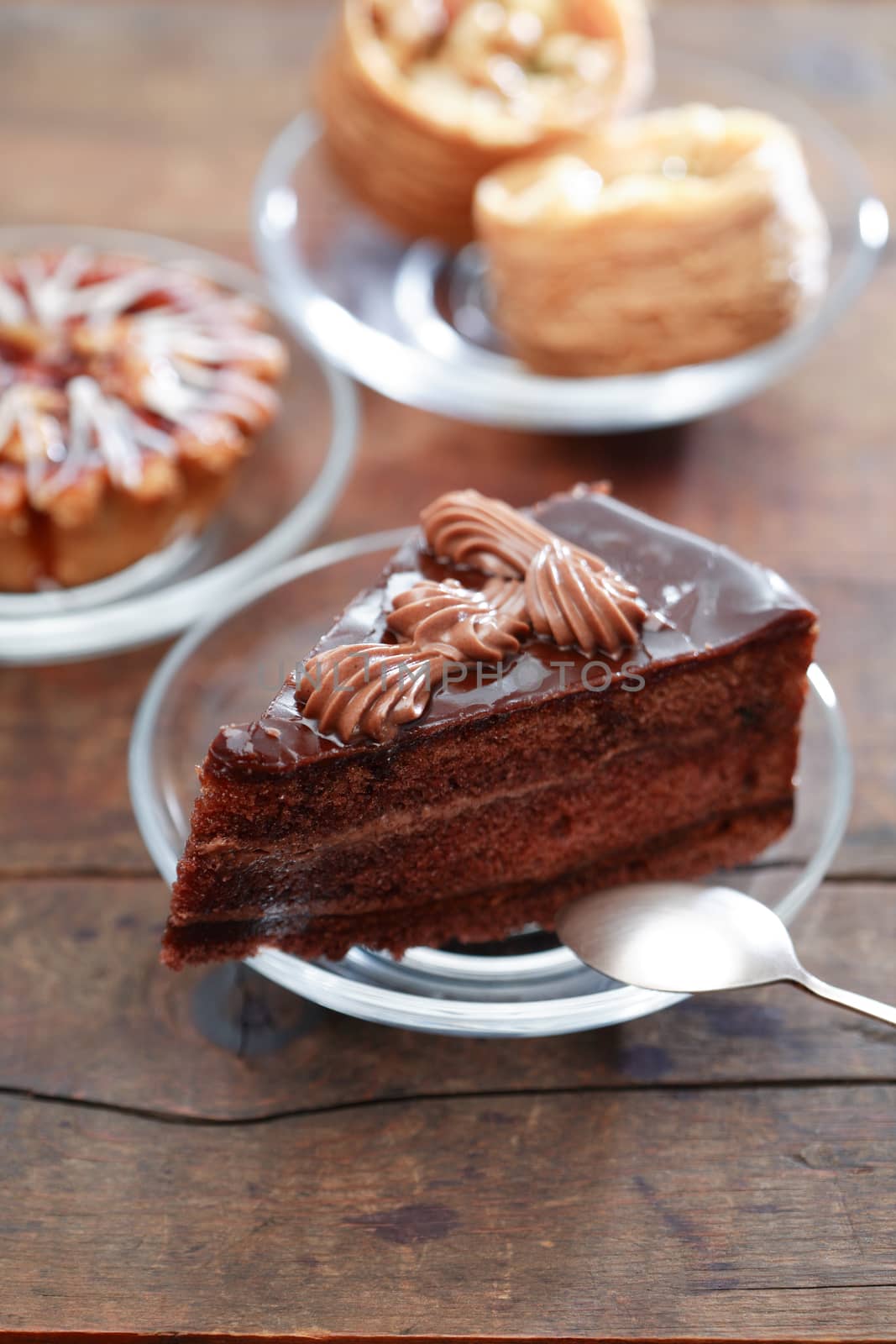 Set of various cakes on nice wooden background